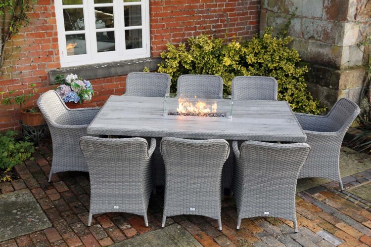Catalan 6 Seat Rectangular Dining Set with Fire Pit In Courtyard