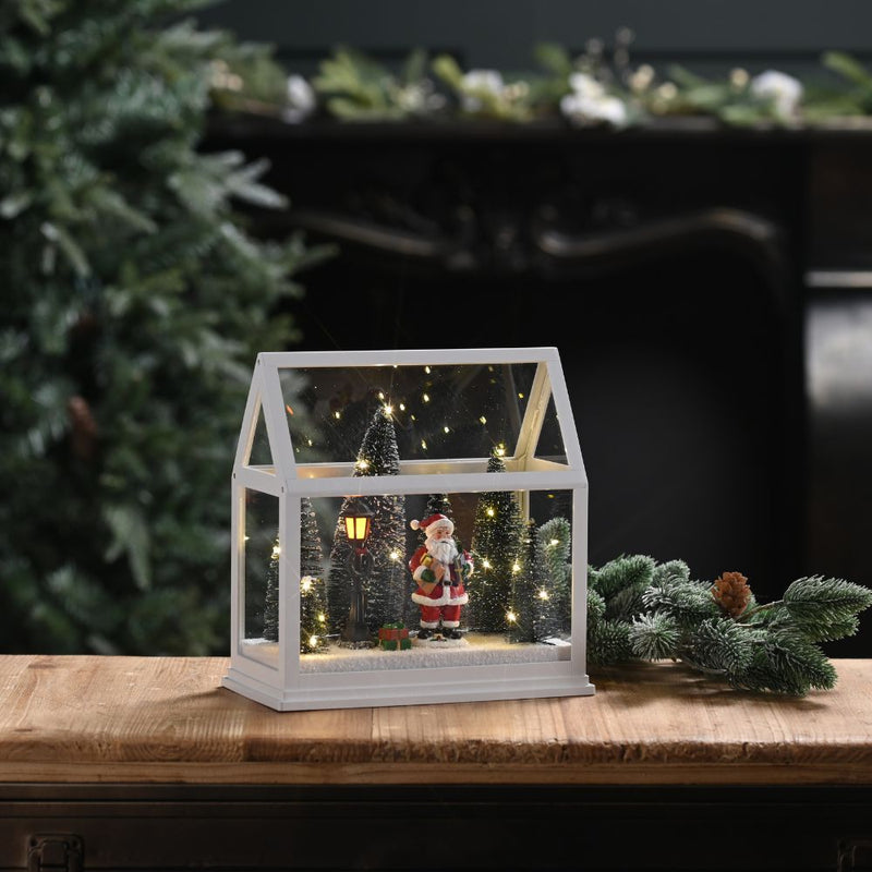 Festive Lit Glass House with Santa and Trees
